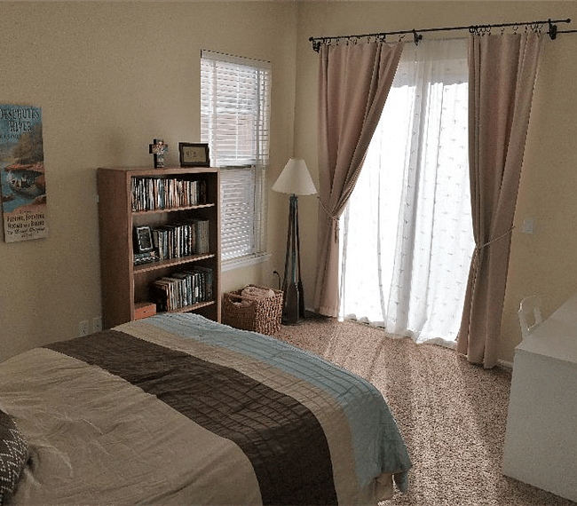 Sliding glass doors face south to let in light.  Close curtains for privacy.  The 6 foot fence in back blocks the view into bedroom.

