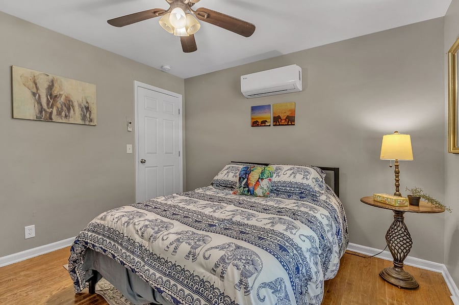 The bedroom has a queen memory foam bed, a closet and chest of drawers