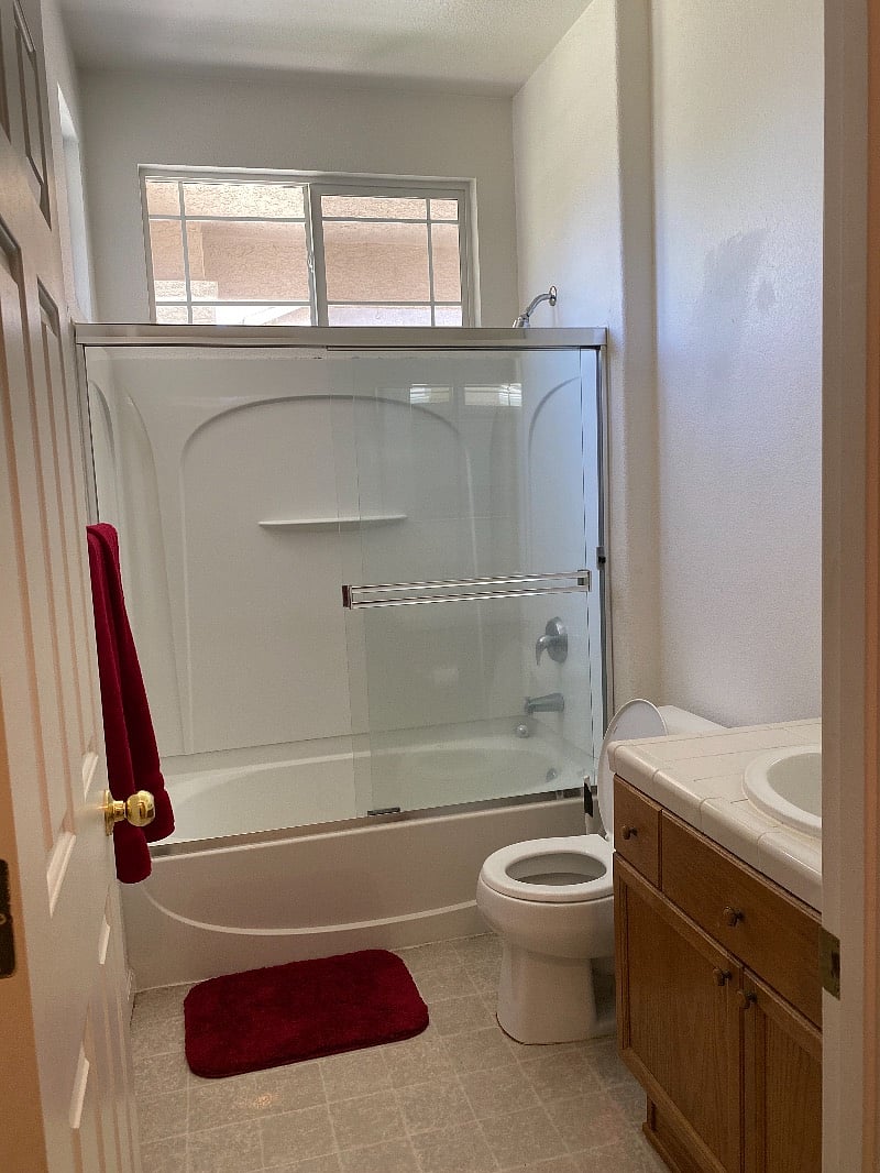 Hall Bathroom with tub and shower.
Access from the hall, located between Front Bedroom and Middle Bedroom.