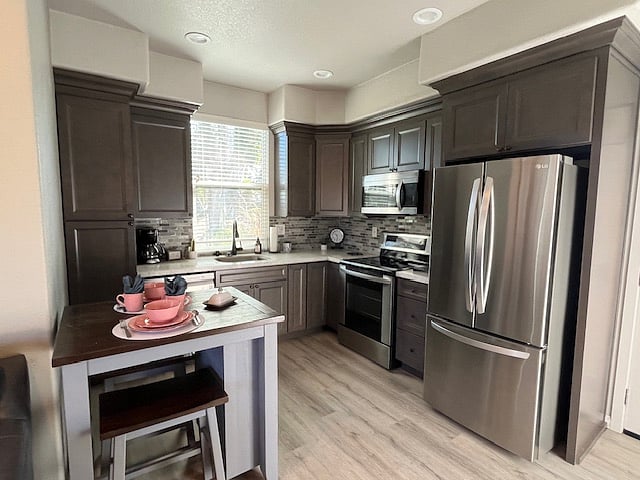 Full kitchen with dishwasher, microwave, oven, electric range and refrigerator