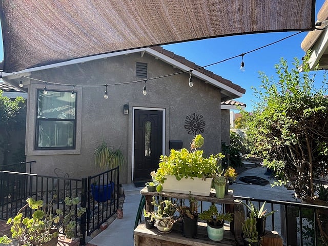 Casita front with fence. View from main house patio