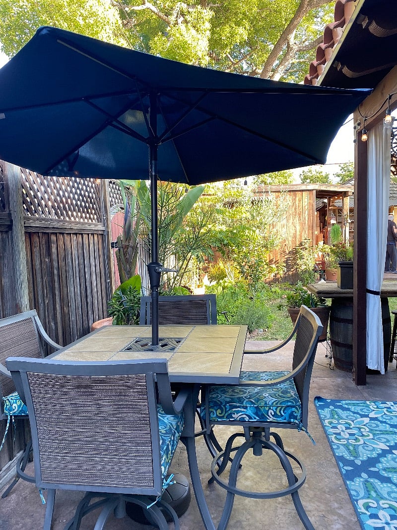 Seating for 4 in private patio area with grill