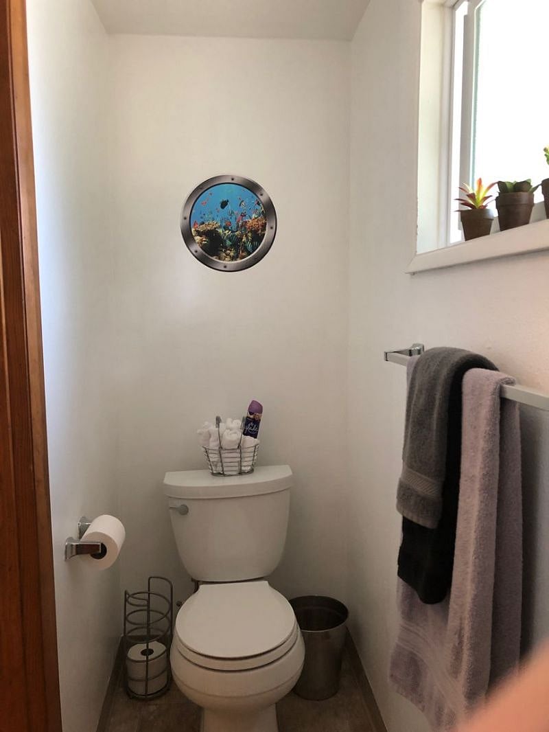 The bathroom is modern and stylish with shower, toilet and vanity