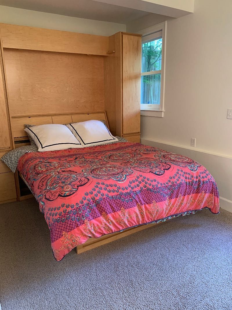 Fold-down Murphy bed, with built-in shelves