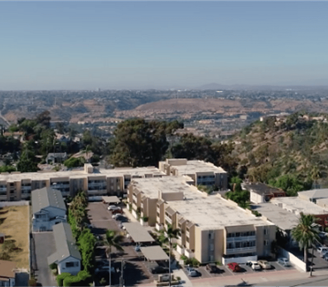 Ariel shot of the complex, this unit is in the back left building, it is a quiet location away from the street. The unit has a secure interior entrance.