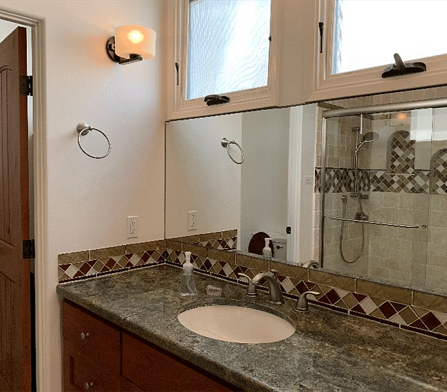 Studio: West facing windows  in shower room.