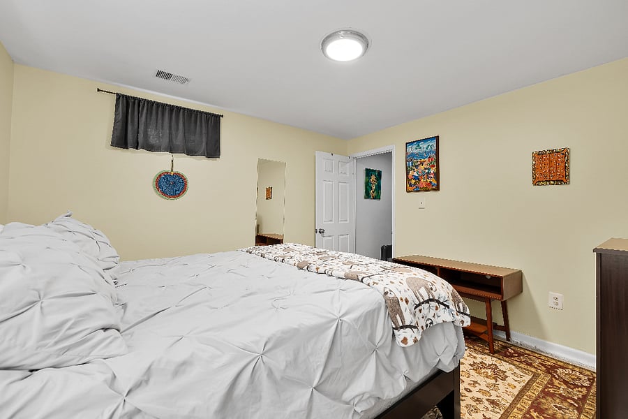 Bedroom with queen-sized bed.