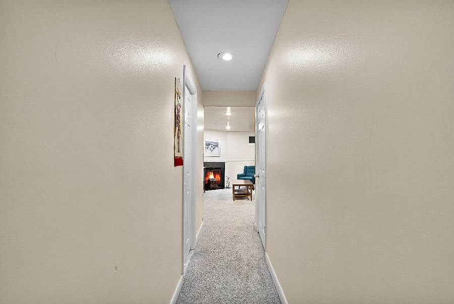 Hallway from the stairs and bedroom to the living and dining areas.