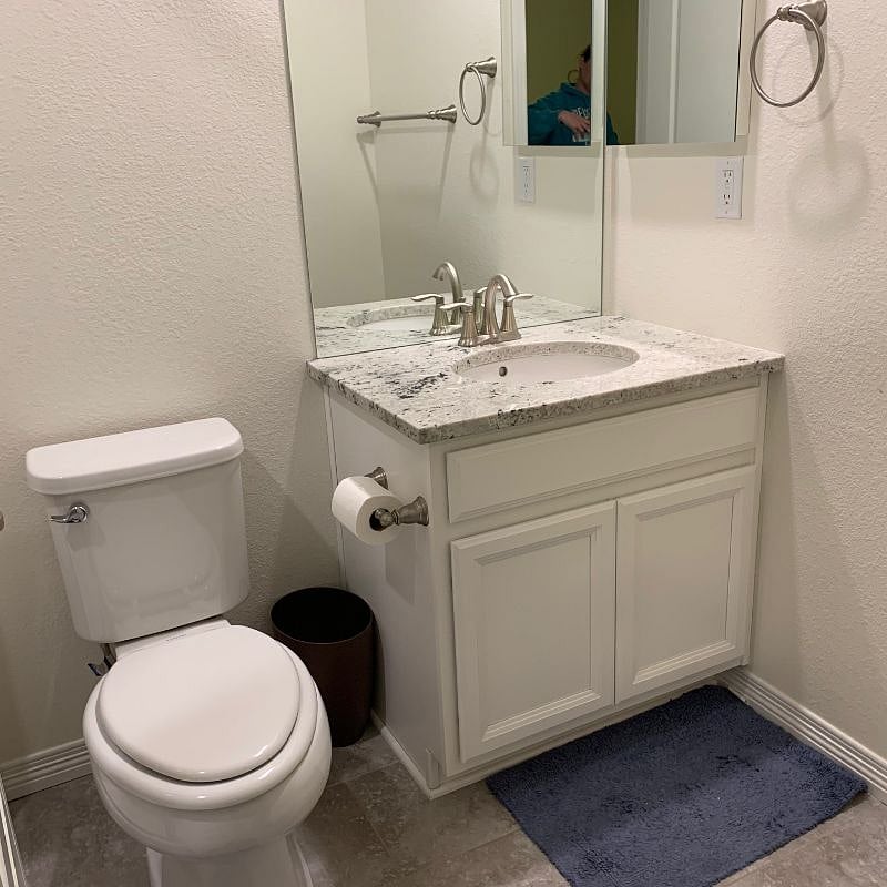 Bathroom - storage in wall cabinet and under sink, room for corner storage if needed