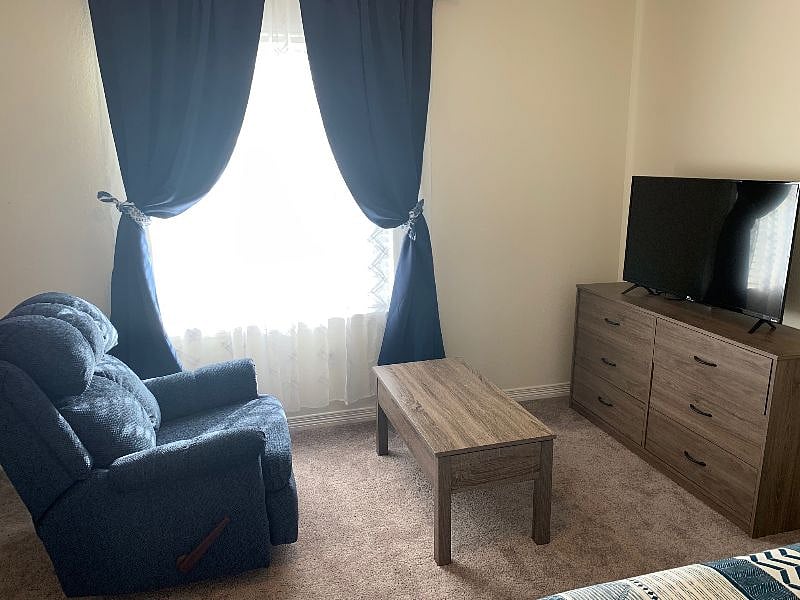 Sitting area in bedroom, blackout curtains