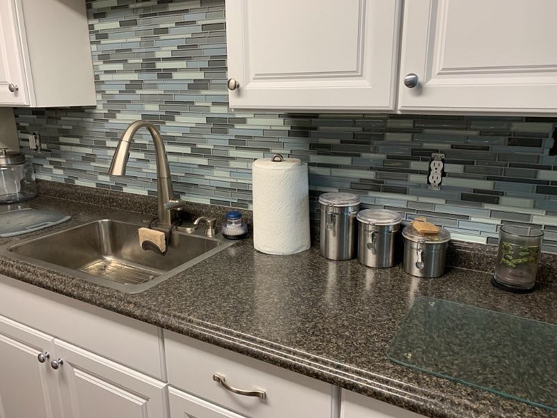 Kitchen sink with tile backsplash