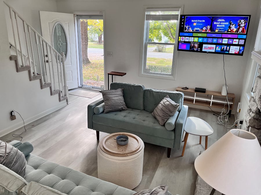 Living room with TV on and front door open ... lovely atmosphere