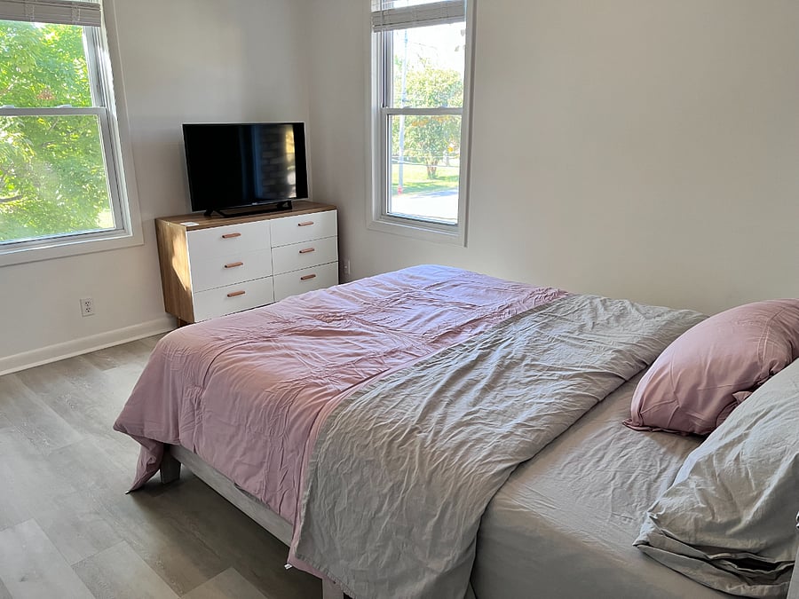 Main bedfroom; still decorating, will be warm and beautiful when you arrive; TV is smart and 40"