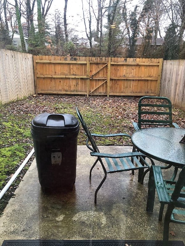 View of backyard and small patio area
