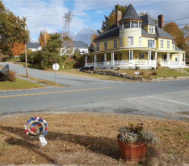 Main house from green with entry carriage way at left