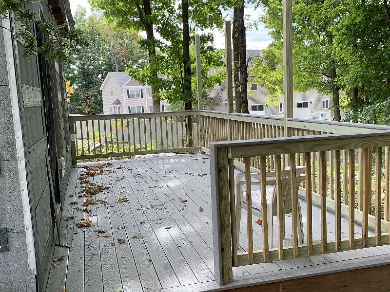 Back deck with view of wooded area.