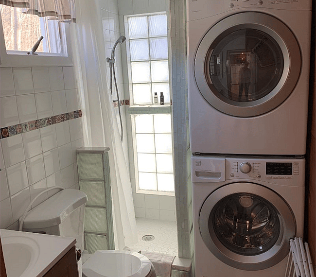3/4 bathroom with washer and drier.