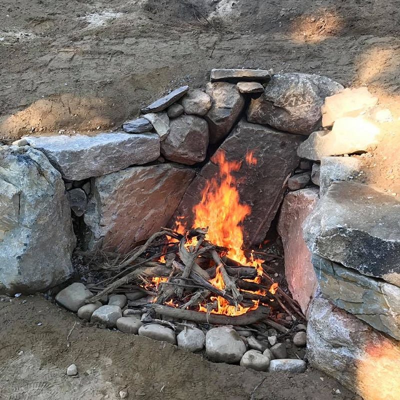 Stone fire pit in yard