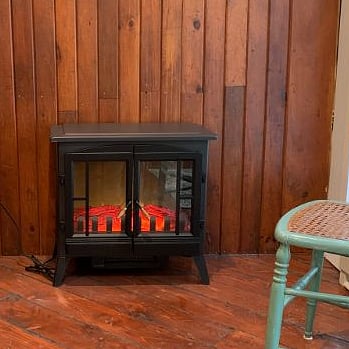 Electric fireplace in dining area.