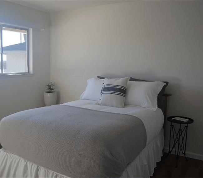 1st bedroom with queen size bed, dresser and large closet