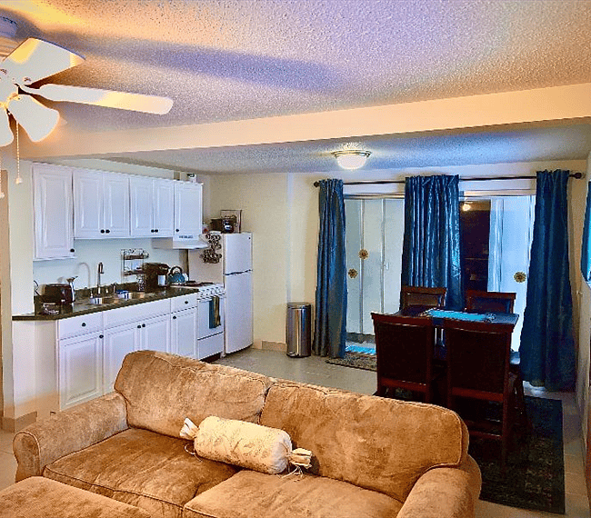 Shot from under the TV into the kitchen and dining area.