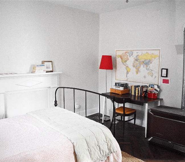 Large and sunny bedroom with original (non working) fireplace and desk area. Full size bed.