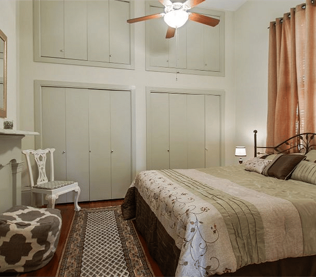 Bedroom has a King-sized bed and tons of closet space