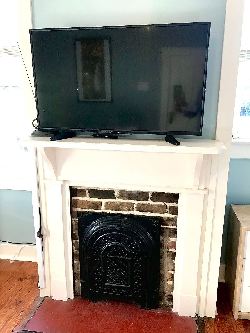 Decorative fireplace and Smart TV.