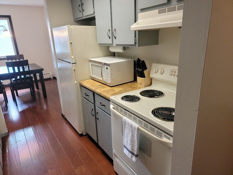 KP101APT4 - Kitchen w/appliances, microwave, dishwasher, cookware/bakeware, place settings, and kitchen essentials, and coffee machine