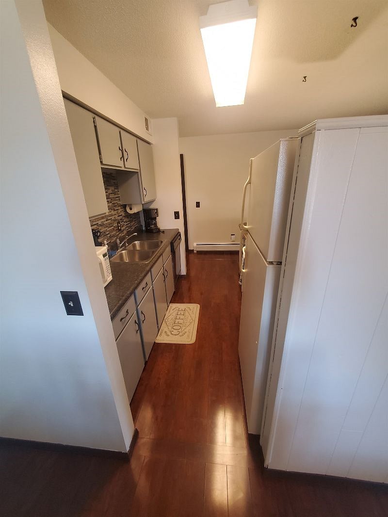 KP101APT1 - Kitchen w/appliances, microwave, dishwasher, cookware/bakeware, place settings, and kitchen essentials, and coffee machine