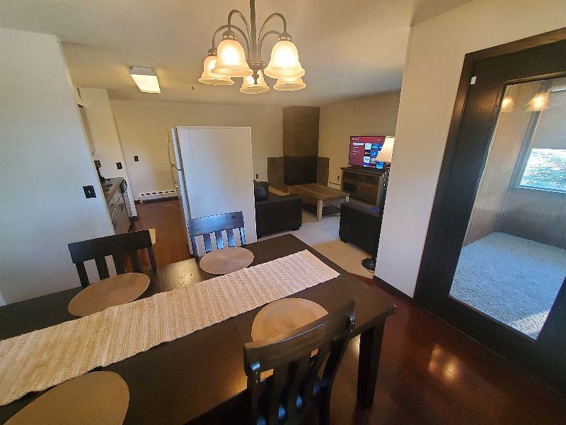 KP101APT1 - Dining Room w/four place settings access to porch