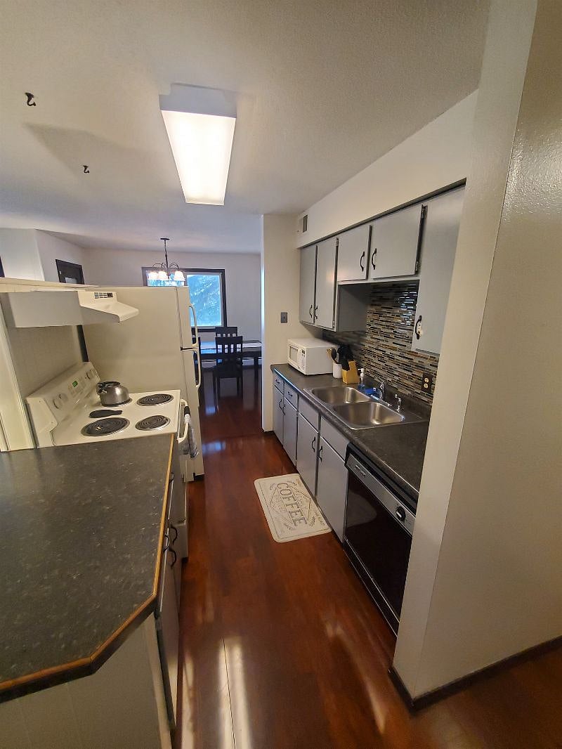 KP101APT1 - Kitchen w/appliances, microwave, dishwasher, cookware/bakeware, place settings, and kitchen essentials, and coffee machine