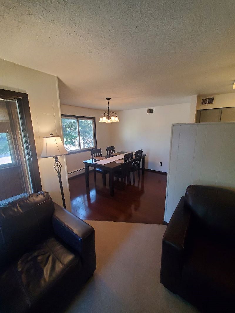 KP101APT1 - Dining Room w/four place settings access to porch
