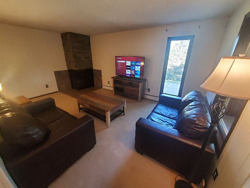 KP101APT1 - Living Room w/two love seats, fireplace, and Roku TV