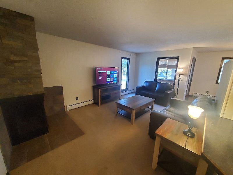 KP101APT1 - Living Room w/two love seats, fireplace, and Roku TV