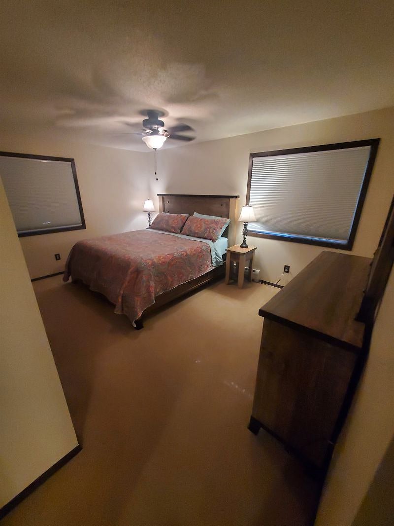 KP101APT1 - Master bedroom w/ king size bed, dresser, mirror, three closets, and ceiling fan