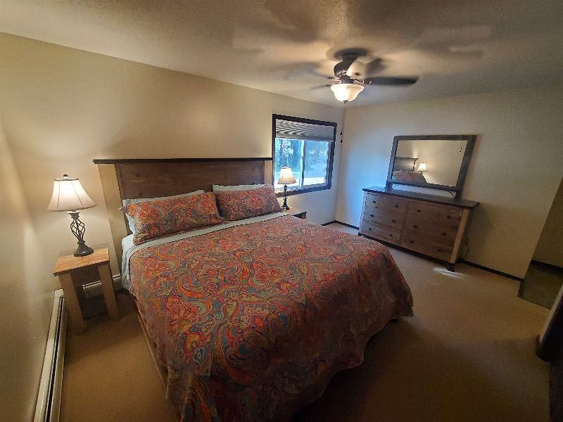 KP101APT1 - Master bedroom w/ king size bed, dresser, mirror, three closets, and ceiling fan