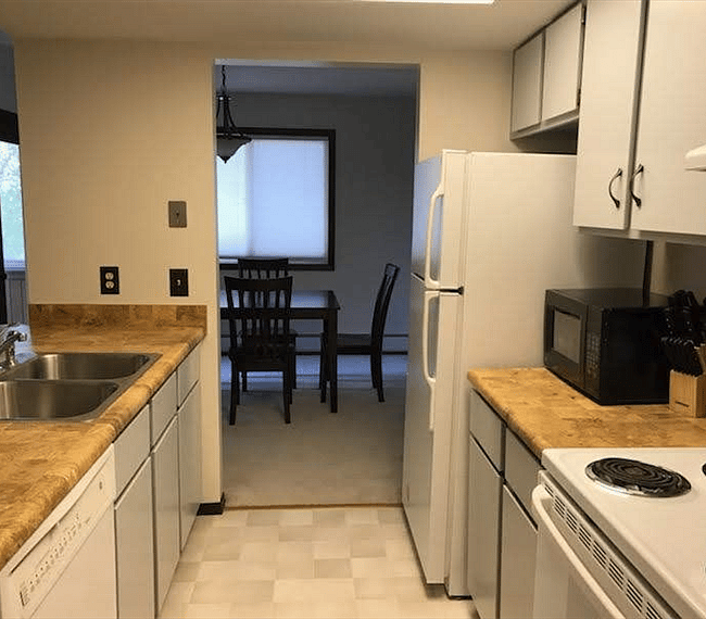 KP101APT5 - Kitchen w/appliances, microwave, dishwasher, cookware/bakeware, place settings, and kitchen essentials, and coffee machine