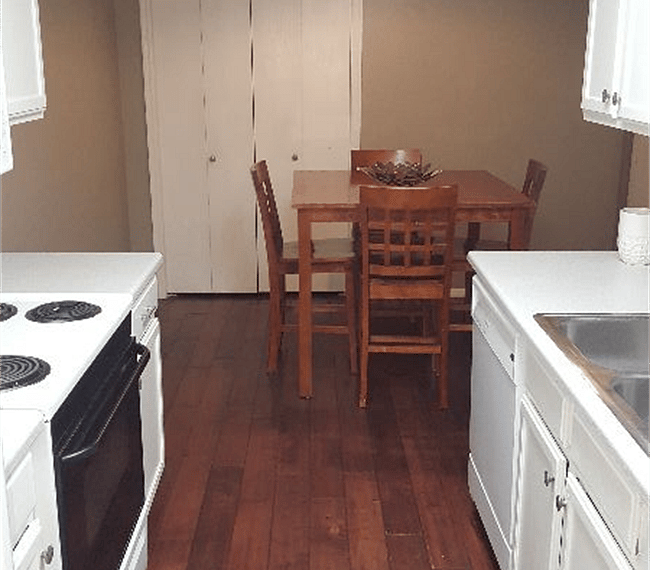 Galley Kitchen with dining table and pantry closet