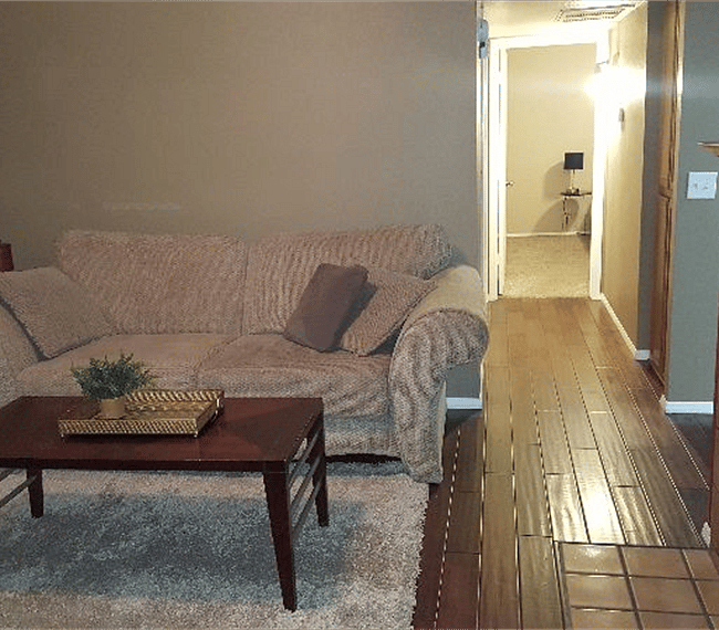 Living room; hallway to both bedrooms - master at end
