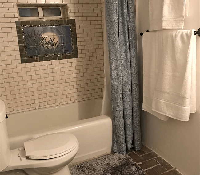 Full bathroom with bath-tub & mirror