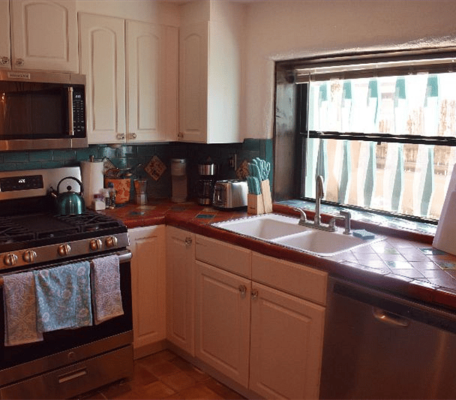 Fully equipped kitchen with all essential implements & counter bar