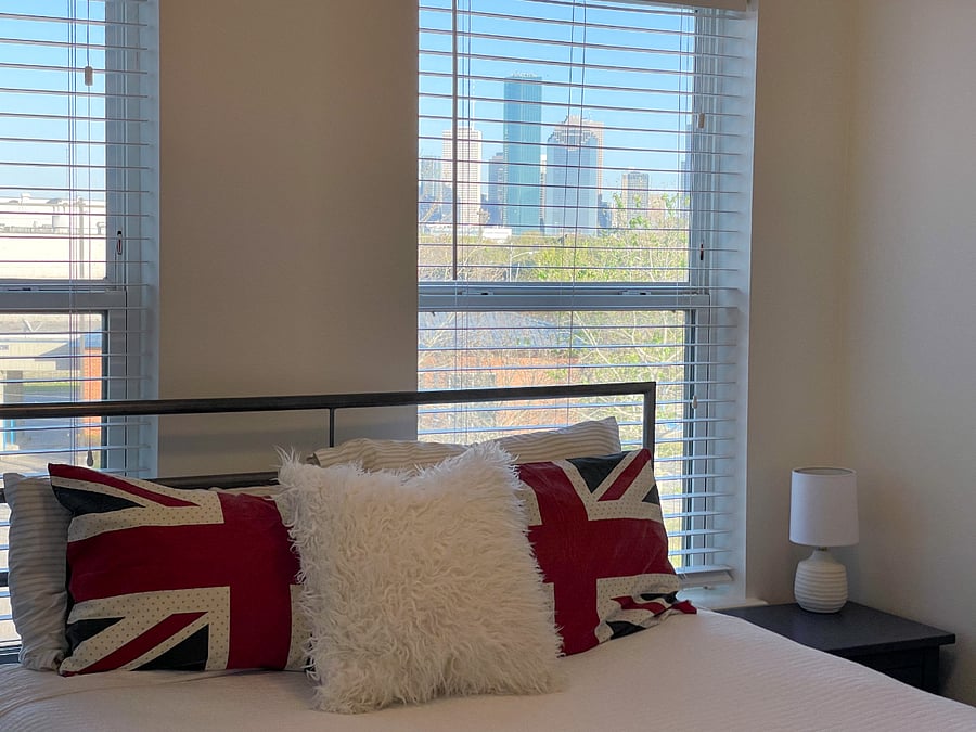 2025 - Bed is now opposite windows, but downtown view is shown nicely here!