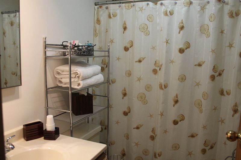 Shared Hall Bathroom with full tub and shower