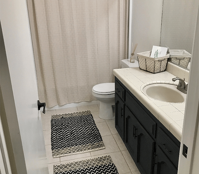 Full bathroom with walk.in shower & mirror