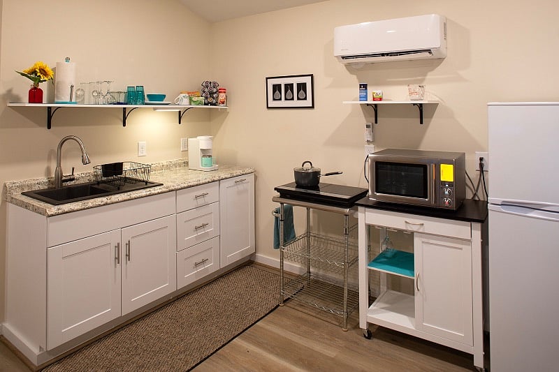 Kitchenette  includes microwave/ convection oven, two burner stovetop, full size fridge & coffee maker. Flatware and cooking utensils also provided.