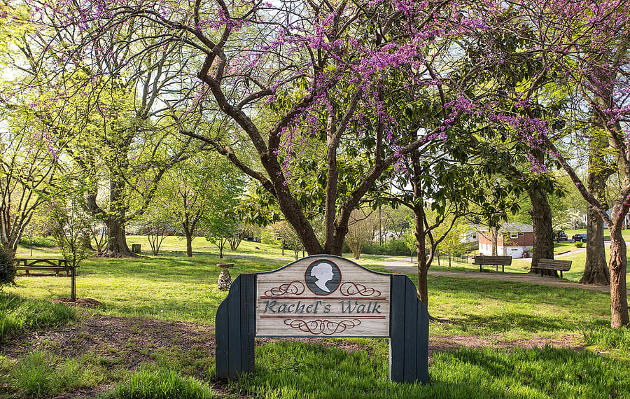 Village park with paved walkway 2 blocks away.