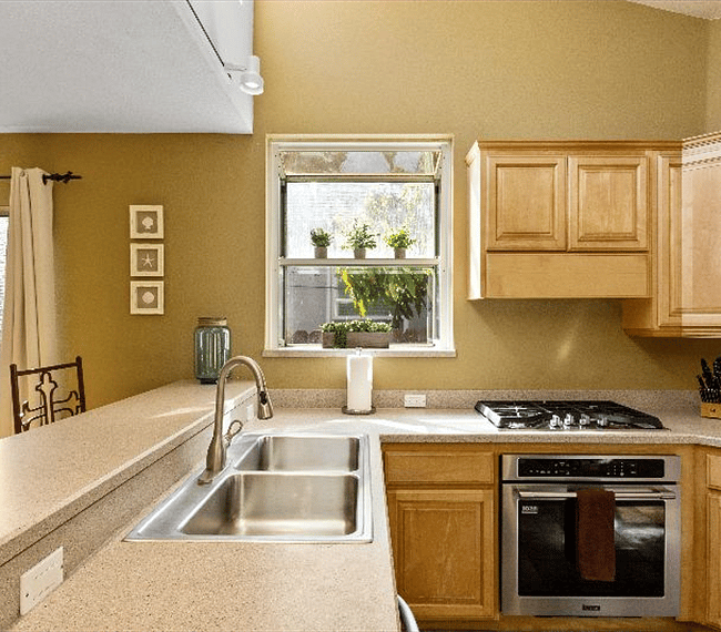 Fully equipped traditional kitchen with wooden shelves and all essential implements included