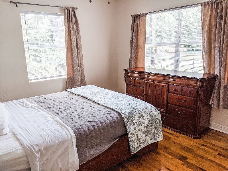 Front bedroom has a tempurpedic queen sized mattress, dresser, and large closet