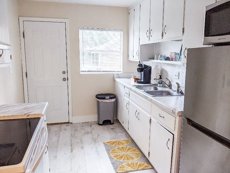 Kuerig coffee maker. Washer Dryer has now been installed - it's to the right as you're facing the stove (it would block the view of the back door from this angle).